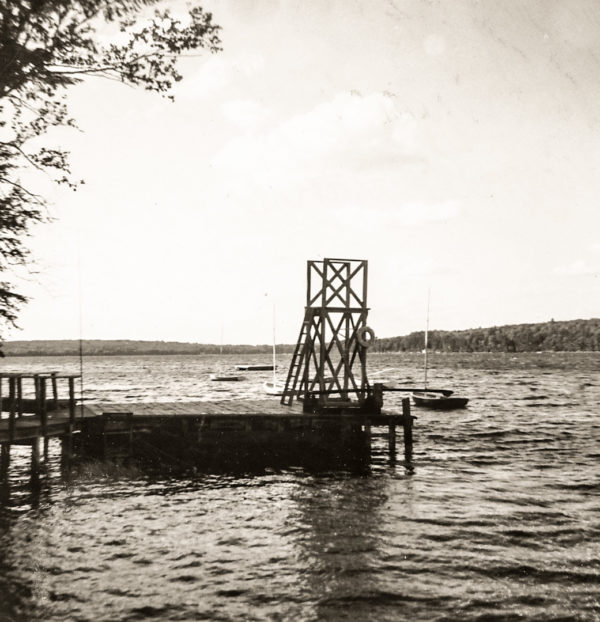 Black and White photo of lake with pier